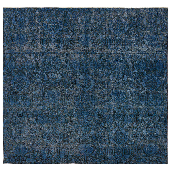 Intricate blue patterned area rug with vintage distressed look.