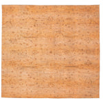 Ornate handcrafted rug with floral motifs in warm color palette