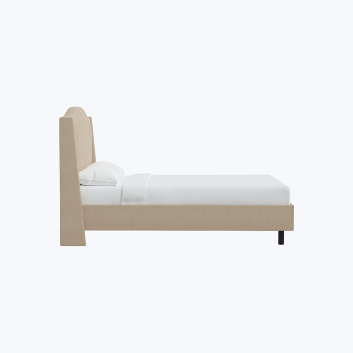 Minimalist beige upholstered bed frame with white bedding, simple design.