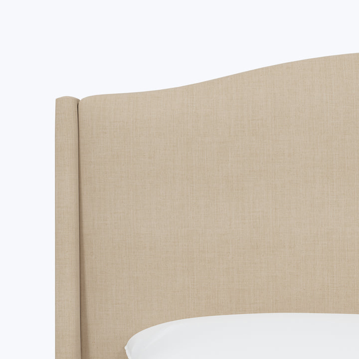 Elegant beige upholstered headboard with simple design and clean lines