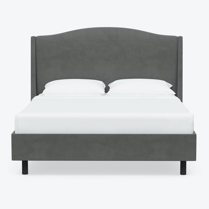 Contemporary grey upholstered bed with minimalist design against white background.