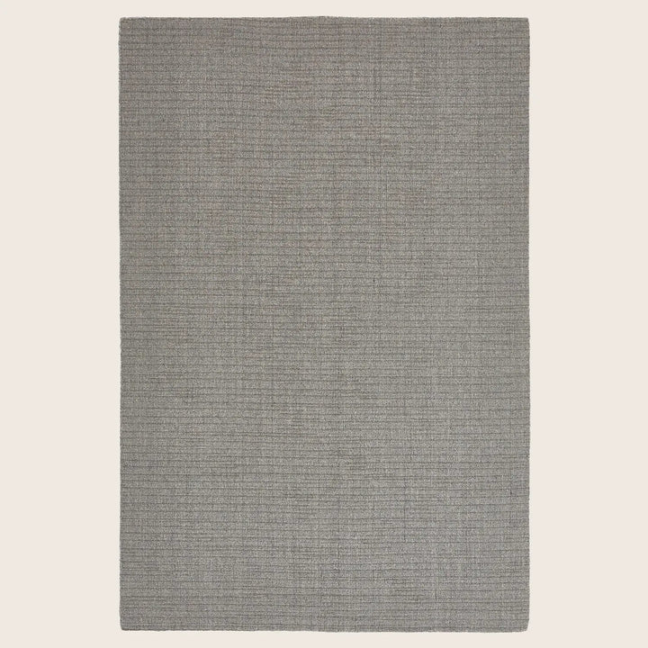 Modern, solid color rectangular area rug with fine textured finish.