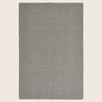 Modern, solid color rectangular area rug with fine textured finish.