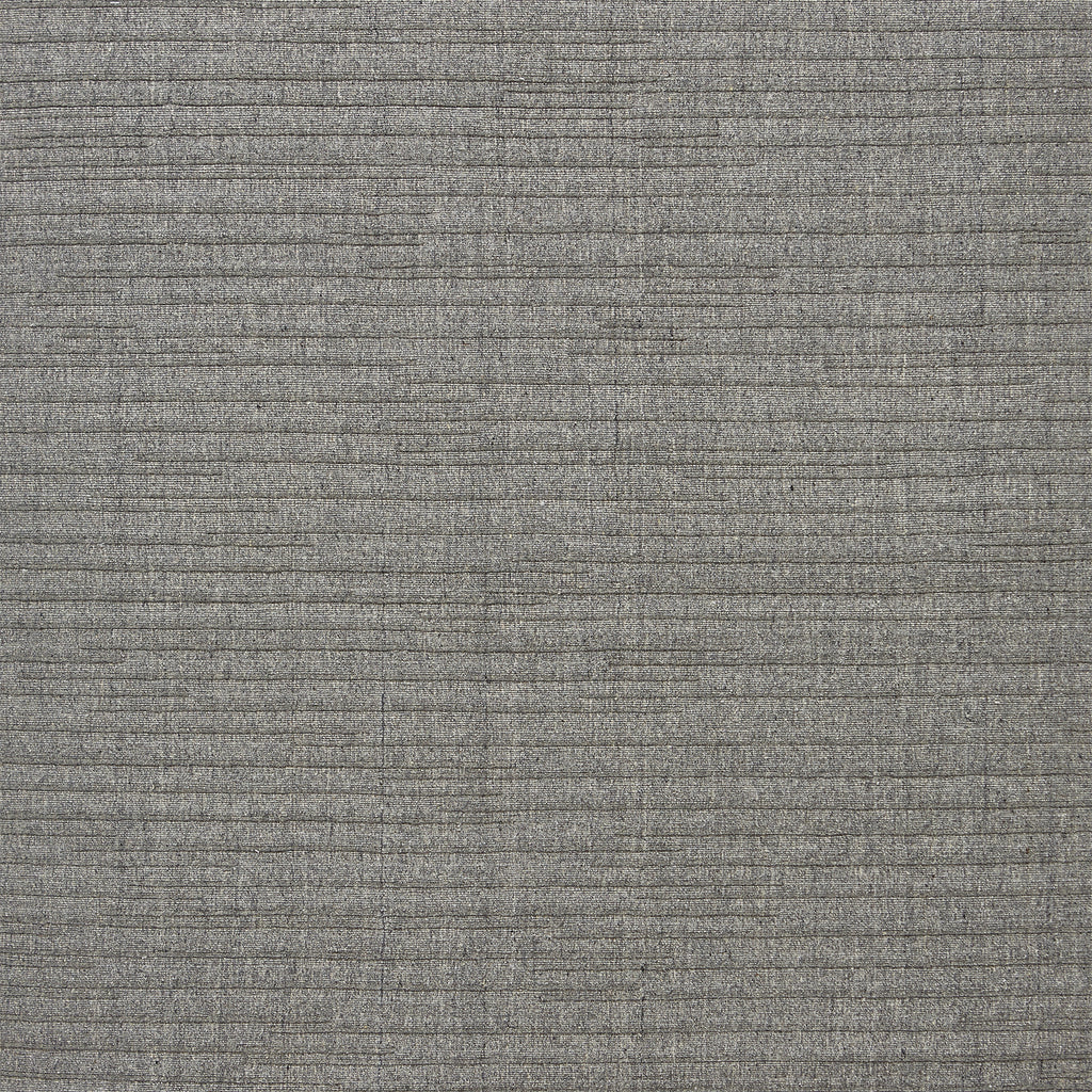 Close-up of gray woven fabric with speckled texture pattern.