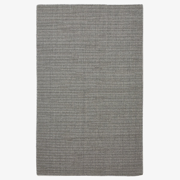 Rectangular gray rug with horizontal lines on white background.