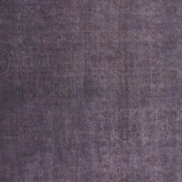 Close-up of textured fabric in faded violet with intricate design