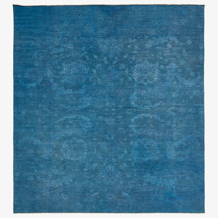 Vintage indigo area rug with subtle floral design, contemporary and versatile.