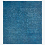 Vintage indigo area rug with subtle floral design, contemporary and versatile.