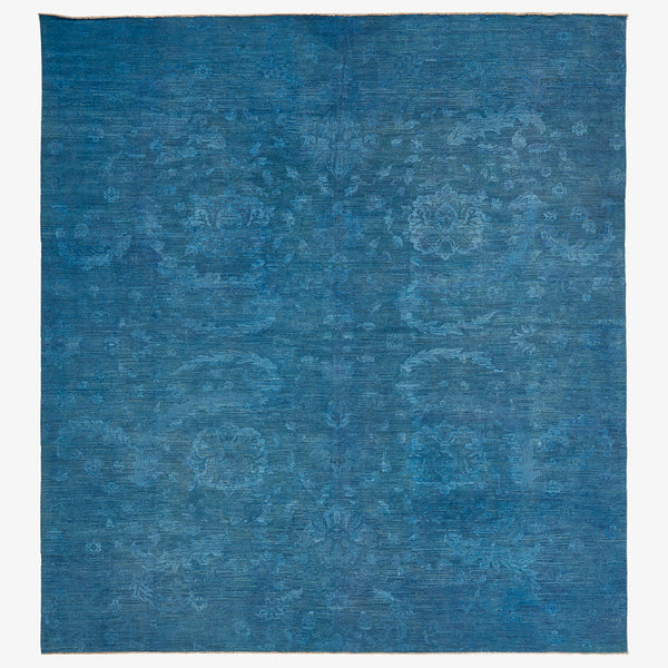 Vintage indigo area rug with subtle floral design, contemporary and versatile.