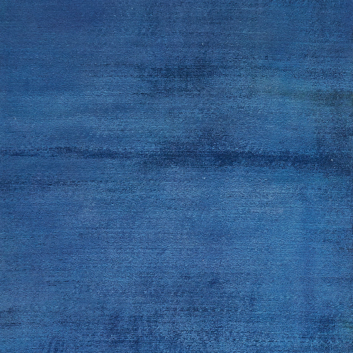 Blue abstract painting with horizontal brushstroke pattern creating movement texture.