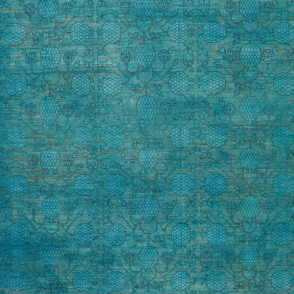 Intricate teal blue textile design with stylized floral motifs.