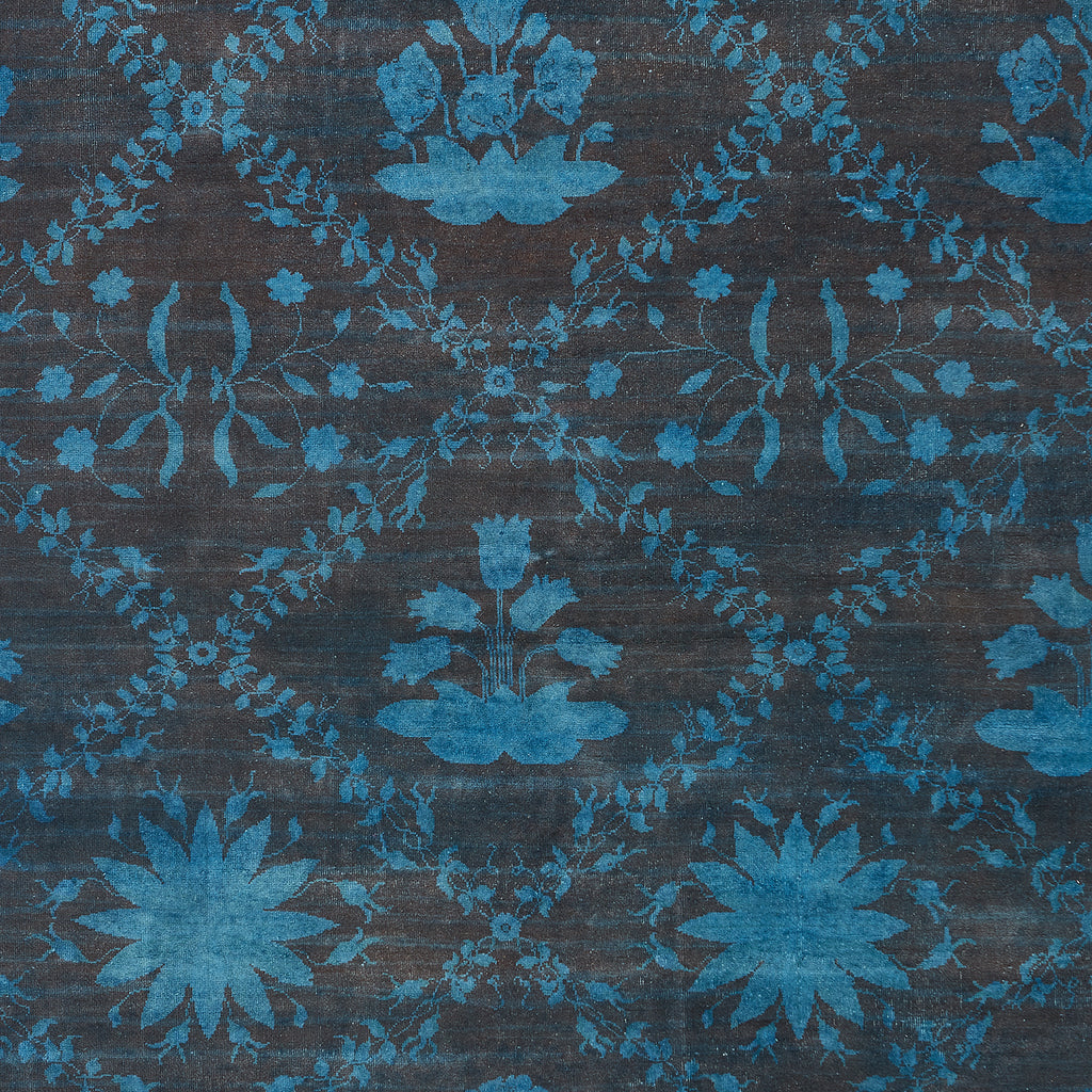 Vintage floral fabric in monochromatic blue color scheme, symmetrical pattern.