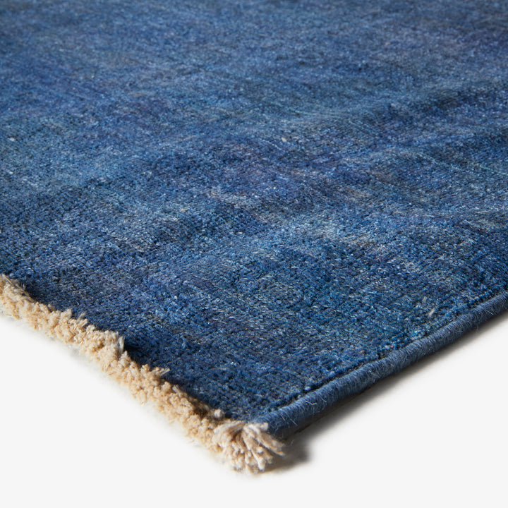 High-quality blue gradient rug with soft, dense pile and fringe