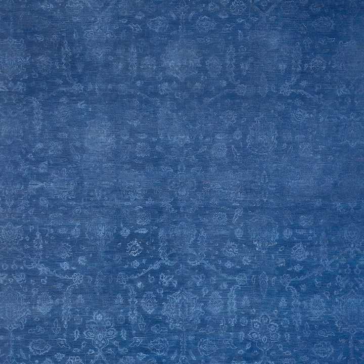 Blue patterned fabric with ornate floral motifs, vintage textile design