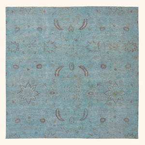 Vintage rectangular area rug with traditional floral design in blue.