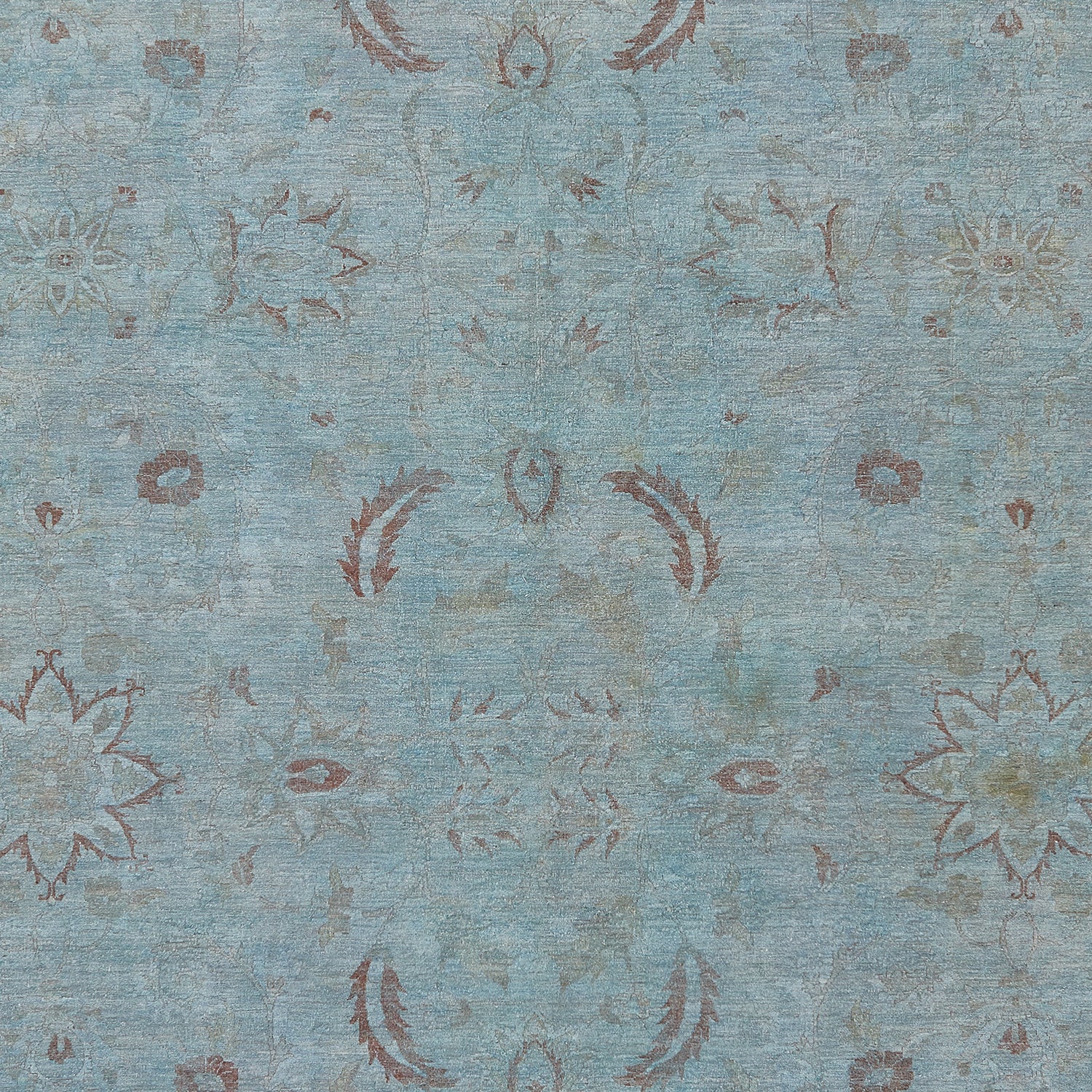 Vintage distressed textile with floral and ornamental symmetrical design.