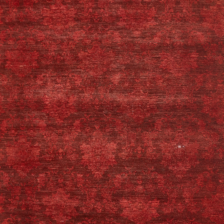 Variegated red textured surface evoking organic, aged appearance.