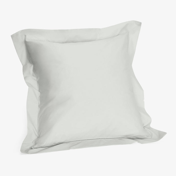 Plain white pillowcase with smooth fabric and simple design.
