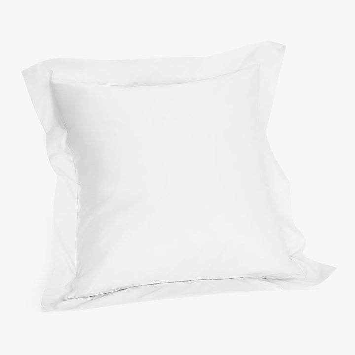 Crisp, clean white pillowcase with simple design and durable fabric