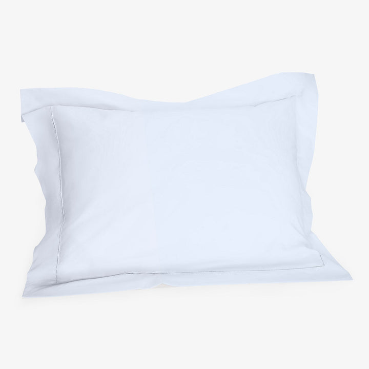 Plain white pillowcase with flanged border displayed against seamless background.