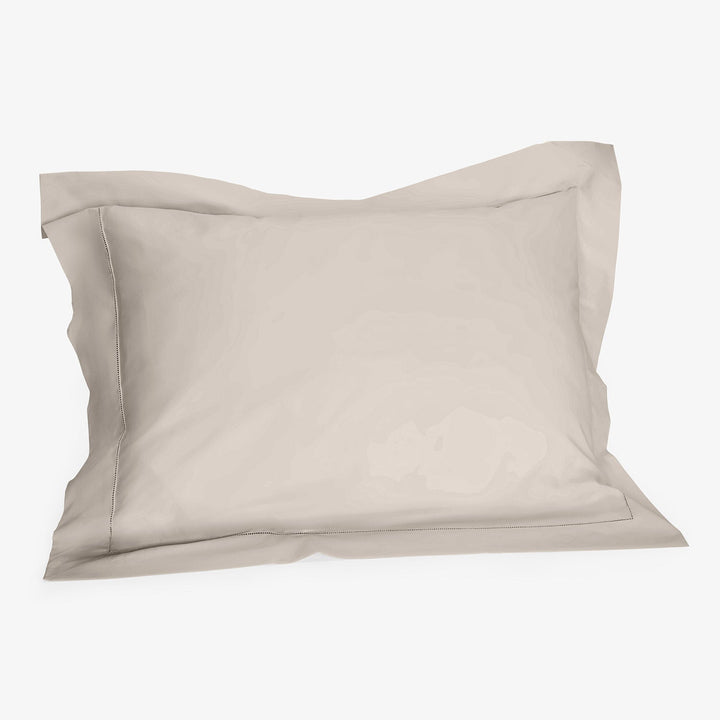Beige pillow with removable pillowcase, 3D rendering on white background.