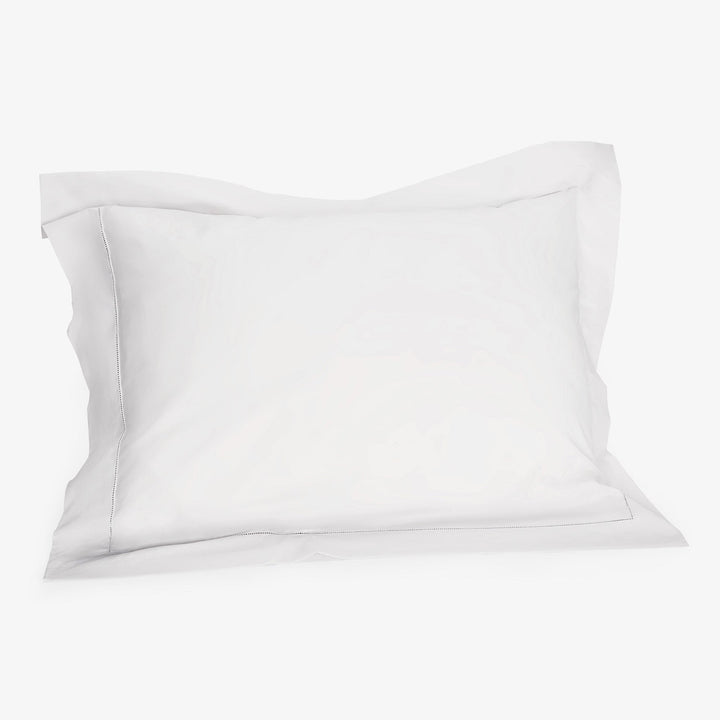 Minimalist white pillowcase with subtle edge design and zipper detail