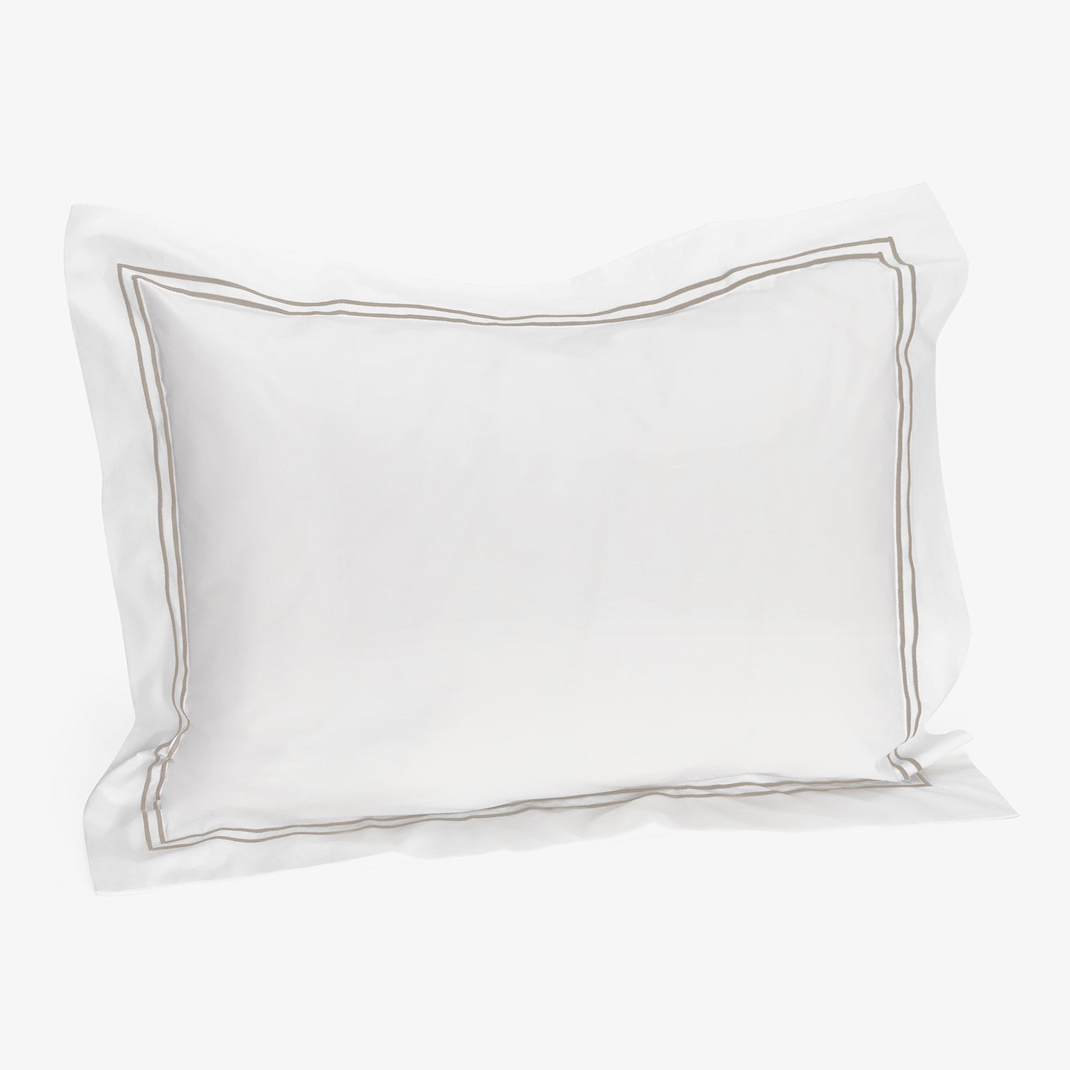 Soft white pillow with stitched border design in taupe color.