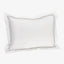 Soft white pillow with stitched border design in taupe color.