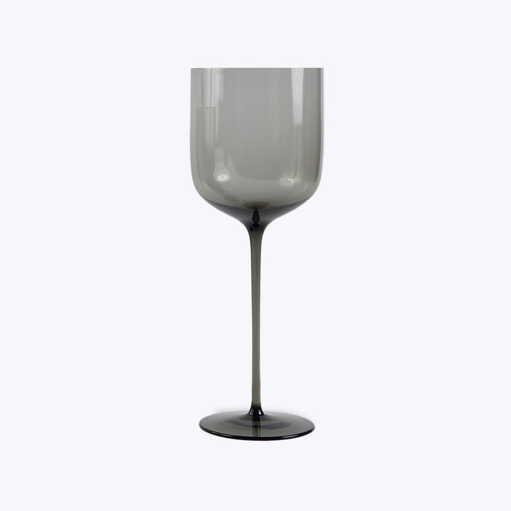Elegant wine glass on light background with modern design.