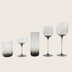Elegant stemmed glass with smoky tint, minimalist background, polished sheen. - hover