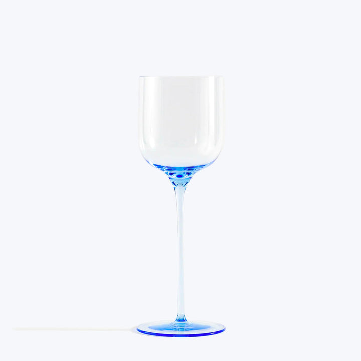 Clear wine glass with blue-tinted stem and base on white background.