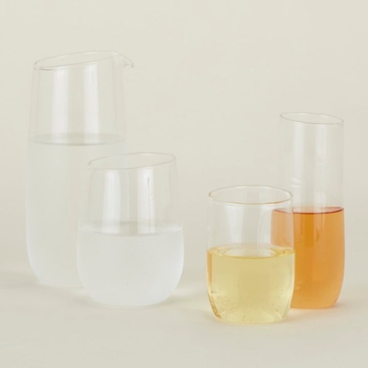 Collection of five modern drinking vessels in various sizes, shapes.
