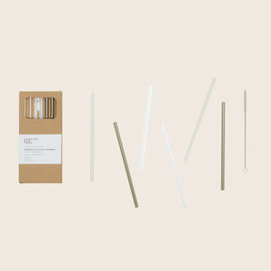 Glass straws with cleaning brush set in packaging, various lengths.