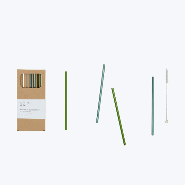 Sustainable glass straws with cleaning brush in eco-friendly packaging.
