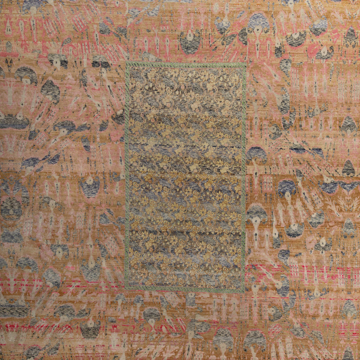 Intricately patterned textile featuring central panel and aged border design.