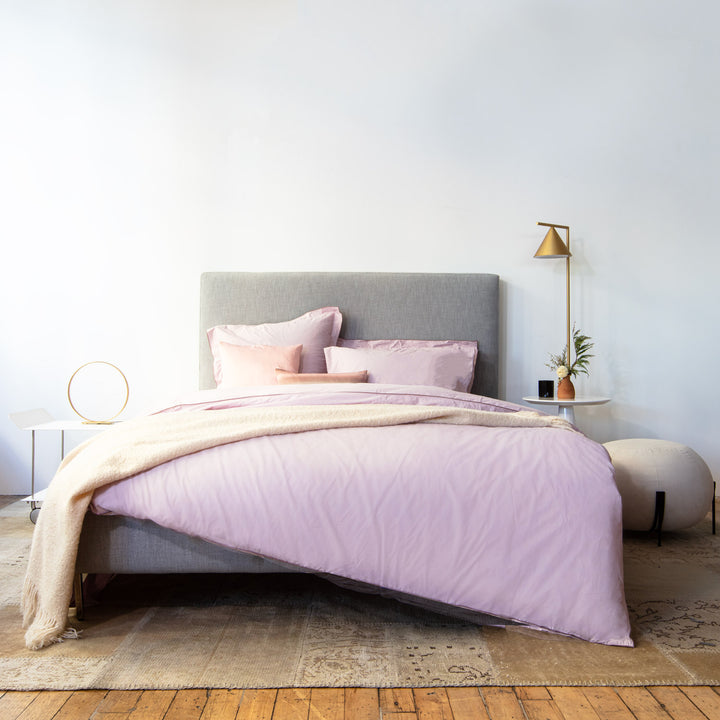 Chic and cozy bedroom with pink accents and vintage decor.