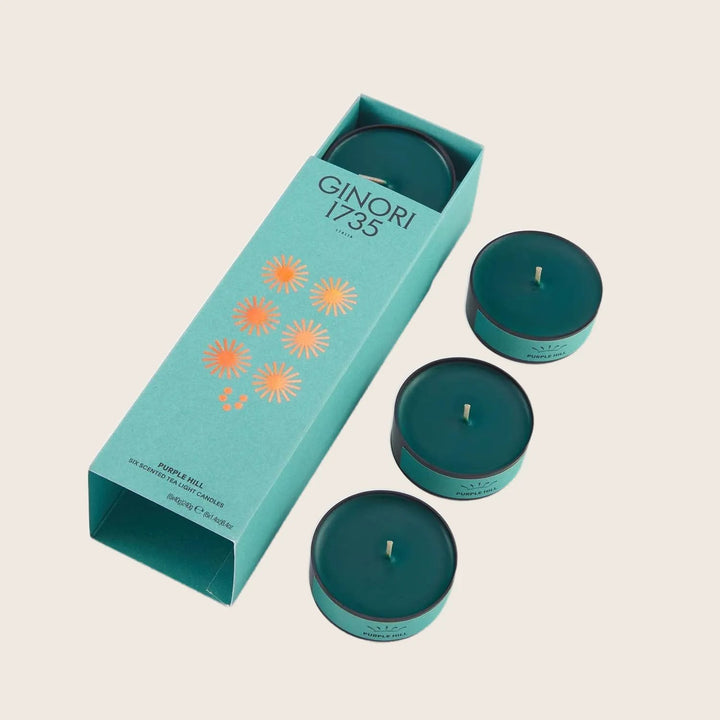 Luxurious scented candles in teal packaging by GINORI 1735.
