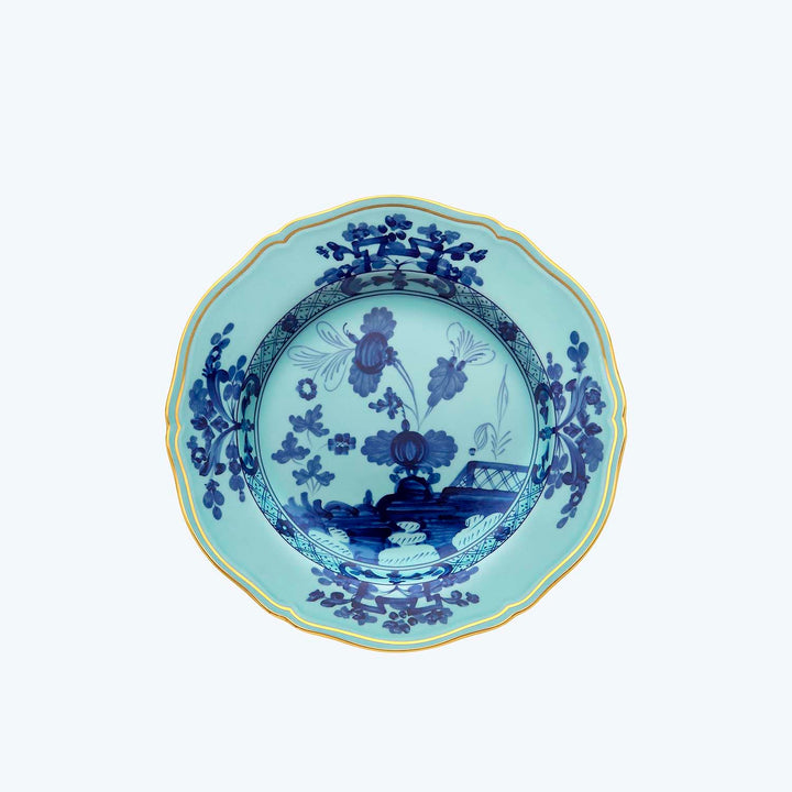 Blue and white porcelain plate with gold trim and floral design