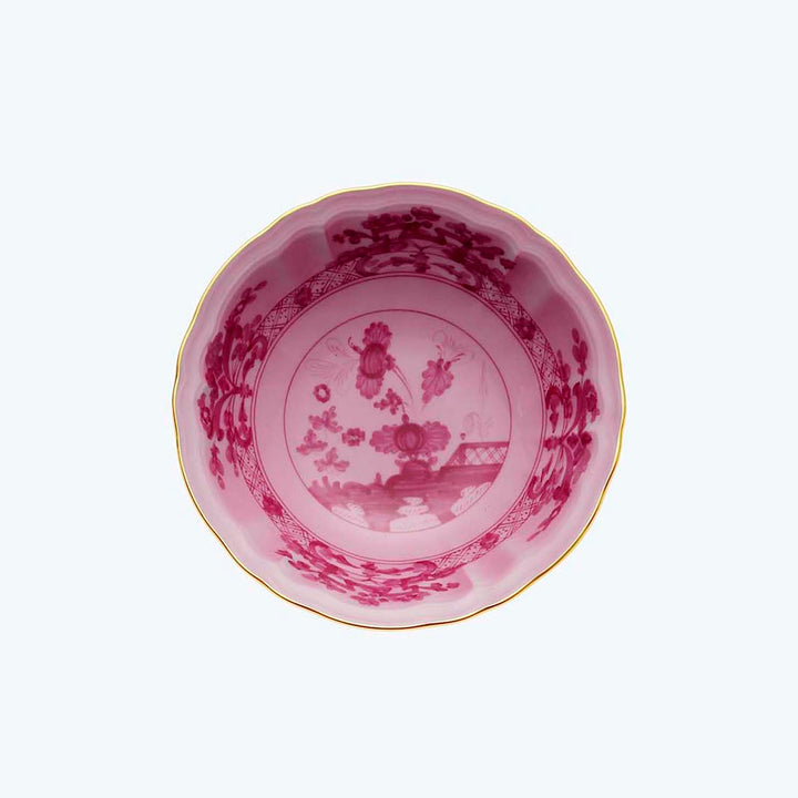 Intricate Asian-inspired ceramic bowl with pink floral design and gold