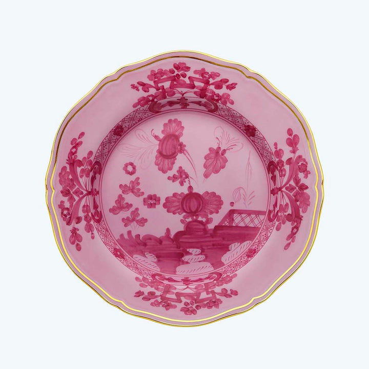 Elegant decorative plate with pink, red, and gold design details.