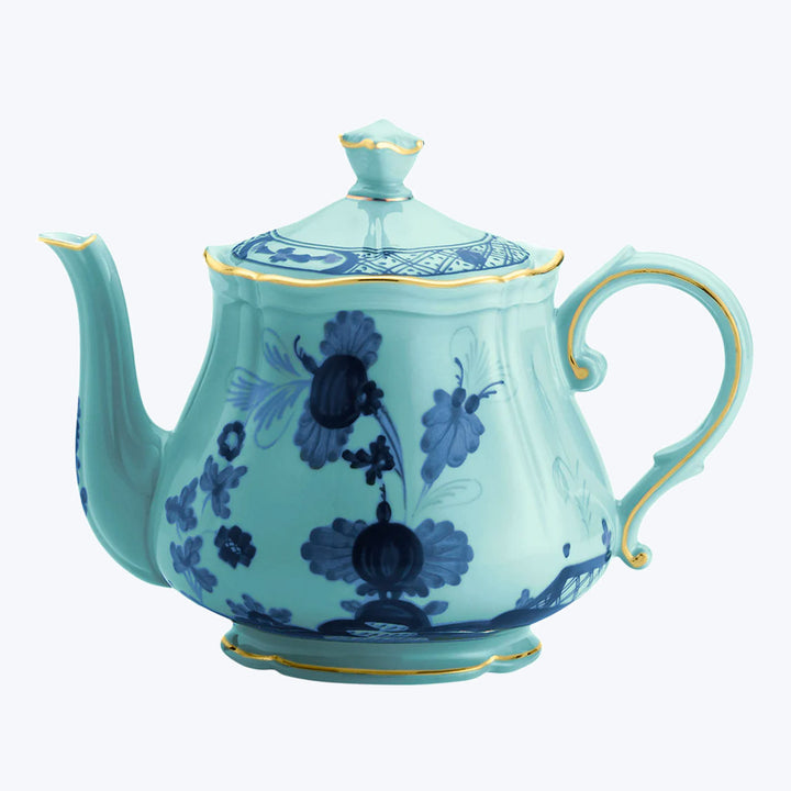 Elegant blue floral teapot with gold accents, classic design inspiration.
