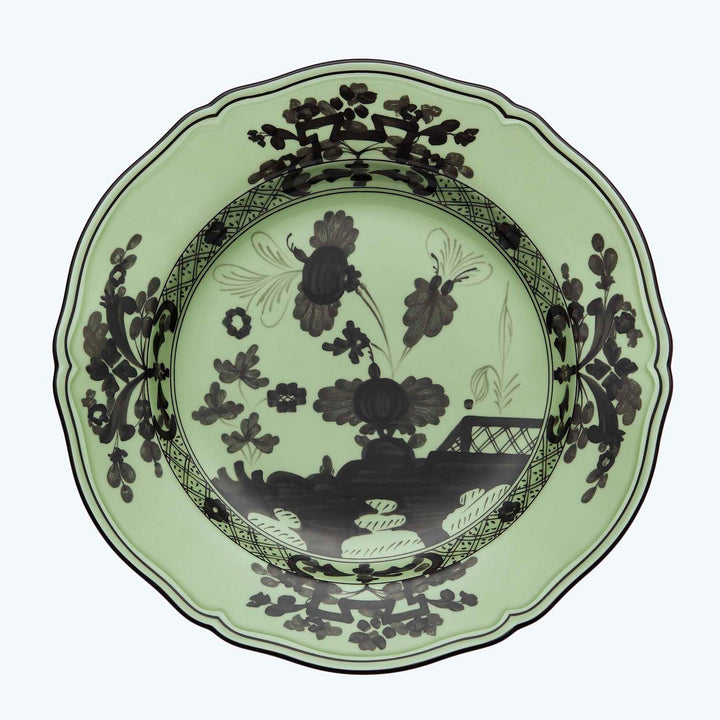 Decorative plate with floral pattern and green border design motif.