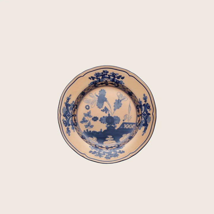 Traditional blue and white ceramic plate with intricate floral design.