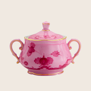 Pink sugar bowl with floral pattern, gold trim and handles.