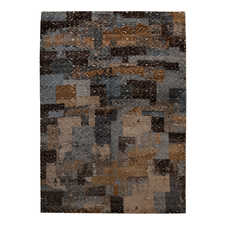 Abstract pixelated design area rug in brown, blue, gray shades.
