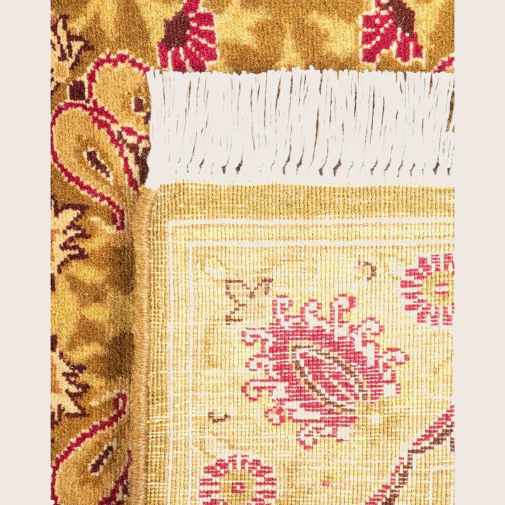Intricately woven textile showcases traditional floral motifs with exquisite craftsmanship.