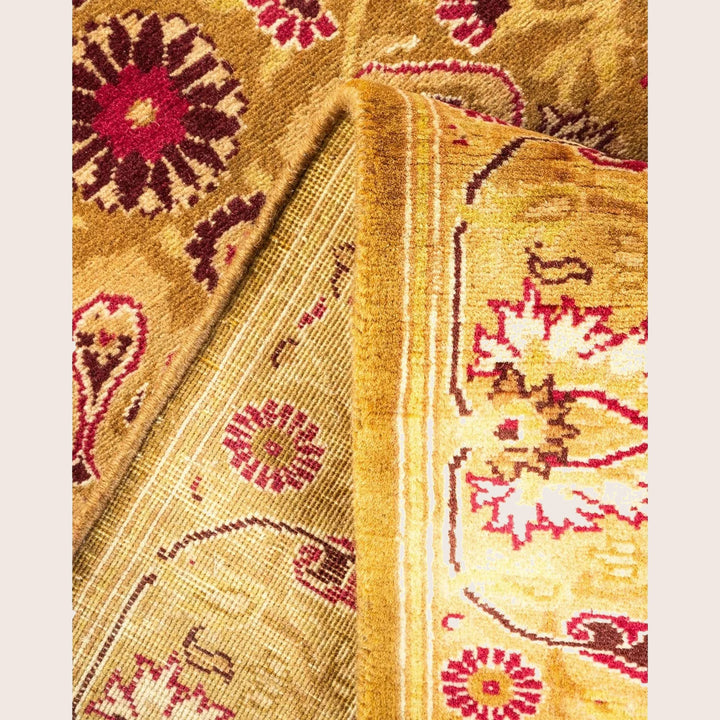 Close-up of a plush, floral-patterned carpet with vibrant colors.