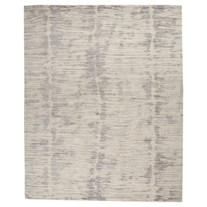 Rectangular area rug with modern distressed brush-stroke design in grayscale. - hover