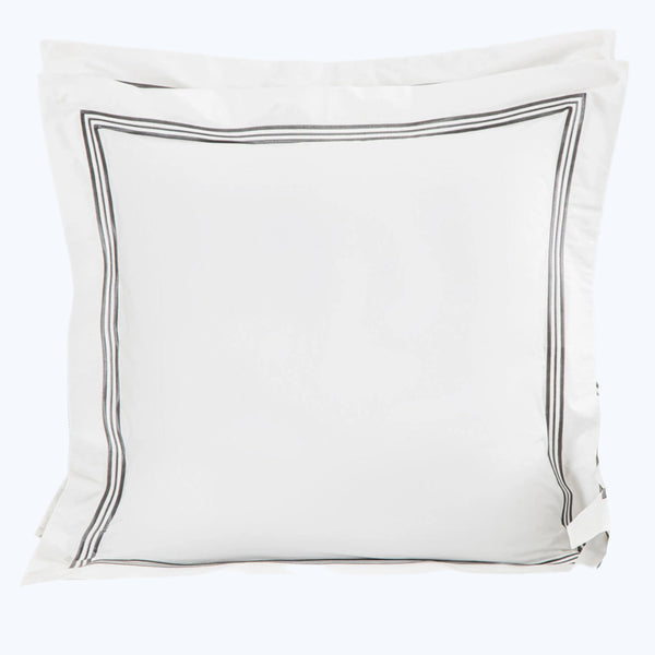 Elegant white pillow sham with triple line border in set.