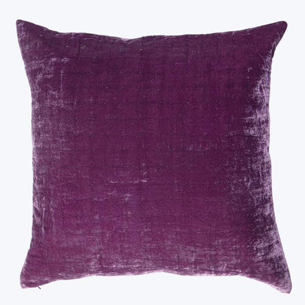 Rich purple throw pillow with crushed velvet texture on white background.